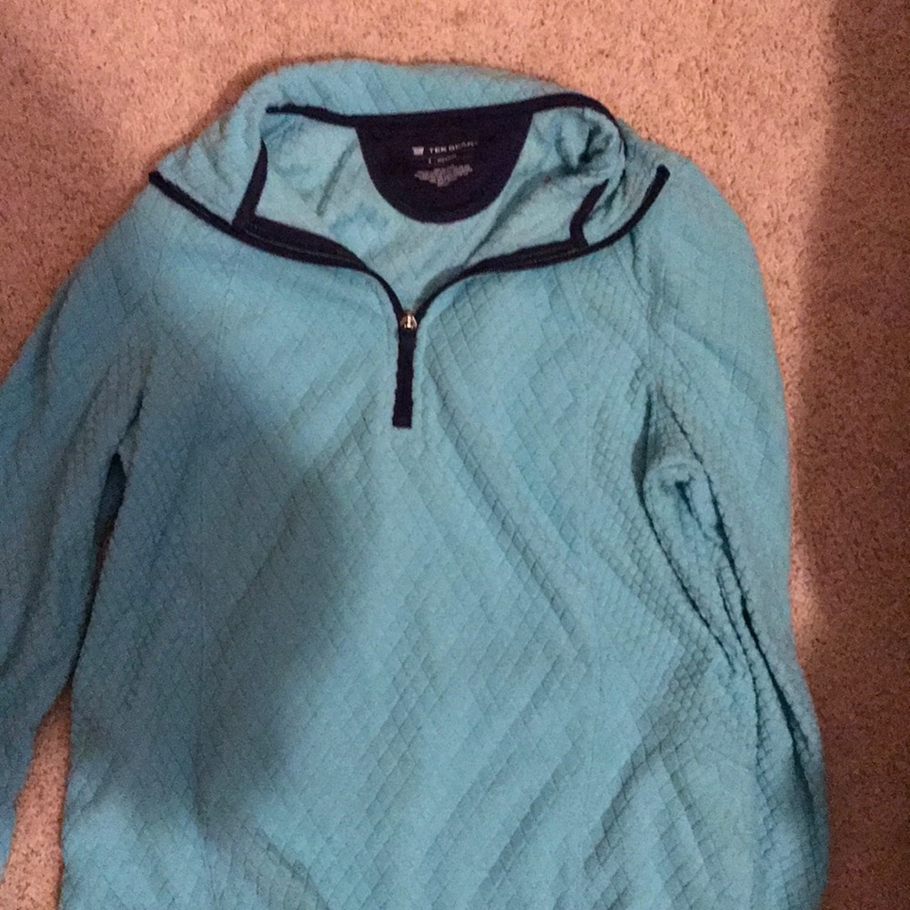 A blue soft/ fuzzy half zip up